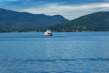 A large passenger ferry seen at a distance on the Pacific Ocean, BC, Canada