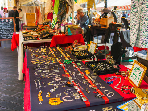 Fototapeta Nice, France, October 14, 2019. A variety of vintage stuff on the counter of the traditional flea market