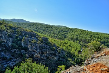 beautiful view of the Turkish mountains covered with green forest on a summer day,