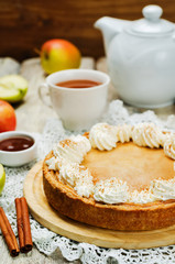 apple cake decorated with whipped cream and cinnamon