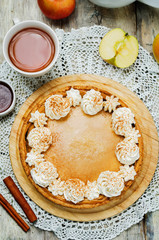 apple cake decorated with whipped cream and cinnamon