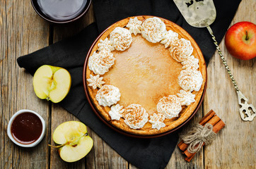 apple cake decorated with whipped cream and cinnamon