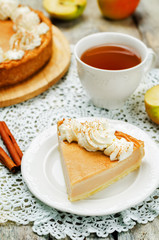 apple cake decorated with whipped cream and cinnamon