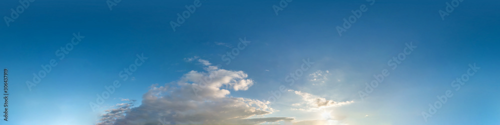 Wall mural beautiful clouds in blue sky with evening sun. seamless hdri panorama 360 degrees angle view with ze