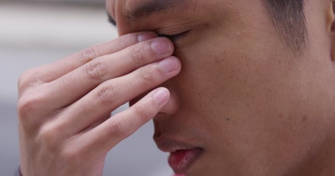 Young stressed out man struggling with a migraine  - Slow Motion - shot on RED