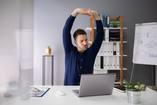 Businessman Stretching His Arms