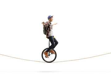 Male teenager riding a unicycle © Ljupco Smokovski