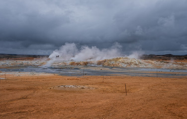 Hverir geothermal area in North Iceland. dy geysers and sulfur field. Orange mountains Iceland.