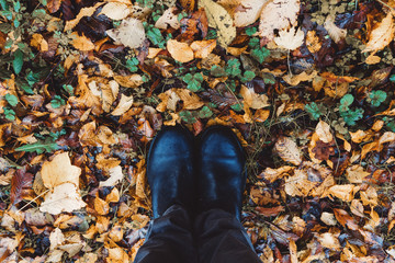 Feet - Boots on autumn leaves