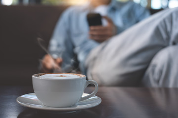 Man using mobile phone at coffee shop