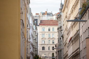 Typical Austro-Hungarian Facades wit old windows in a narrow street of Innere Stadt, the inner city of Vienna, Austria, in the 1st Bezirk district of the Austrian capital city