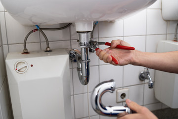 Plumber Fitting Sink Pipe