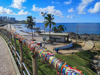 Senhor do Bonfim colorful ribbons tied in a grid at Barra Lighthouse - Salvador, Bahia