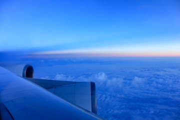 View of cloud and twilight from the window of airplane