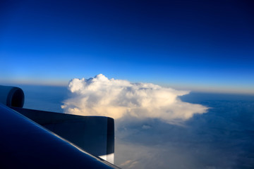Fototapeta na wymiar View of cloud and twilight from the window of airplane