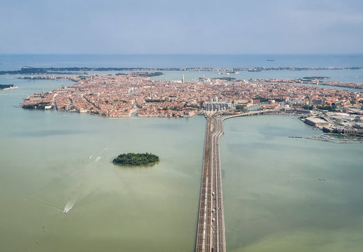 Venice, Italy - Panoramic aerial view. Top view of popular Venice on a sunny day from a window plane.