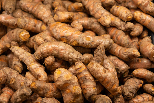 Pile of fresh turmeric roots view from top