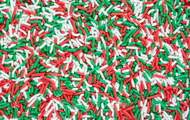 background texture-full frame close up of red, green and white Christmas candy sprinkles