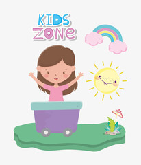 kids zone, cute little girl in wagon with rainbow sun and mushroom outdoors