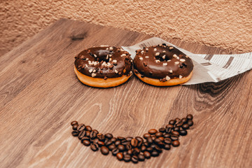 smiling face with donuts and coffee