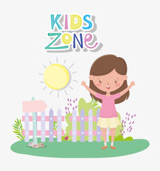 kids zone, happy cute girl in the garden with fence