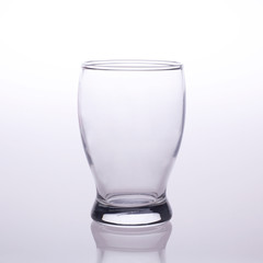 Empty glass isolated on grey and white background