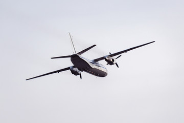 Fototapeta na wymiar Freight military plane in the clear sky,