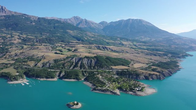 Serene summer landscape of Lake Serre-Poncon, artificial lake surrounded by French Alps, Provence-Alpes-Cote d Azur region