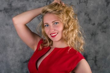 portrait of  blonde girl in red dress