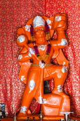 A deity of Hanuman, the Hindu monkey god in a small shrine in Gangotri, India.