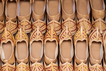 A close up of some  traditional childrens shoes in a shop in Inida.