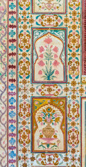 A floral design on the wall of the Ganesh Pol at Amber Fort in Rajasthan, India.