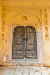 Wooden doors at the ancient Amber Fort in Rajasthan, India.