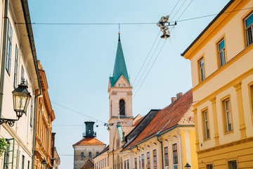 Fototapeta na wymiar Saint cyril and methodius church and upper town street in Zagreb, Croatia