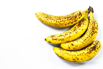 Organic bananas with freckles on fruit peels
