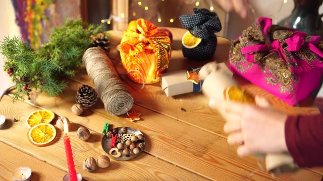 Zero Waste Friendly Christmas Gift Wrapping. Reusable, recyclable and compostable materials - fabric, Kraft paper and dried fruit