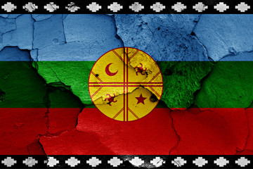 flag of Mapuche painted on cracked wall