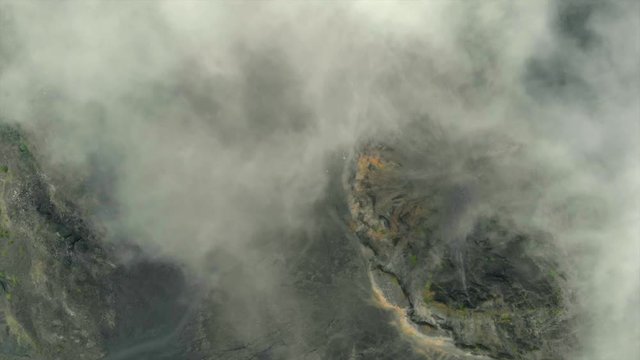 DRONE:  FLY OVER VOLCANO WITH CLOUDS