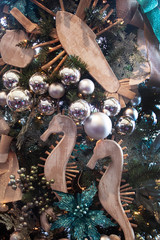 Under the Sea Christmas Tree Detail. Close up of a ocean themed Christmas tree. Whimsical and unique nautical holiday decorations. Winter holiday meats the crashing water. 