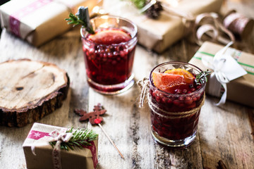 two glasses berry citrus christmas drink 