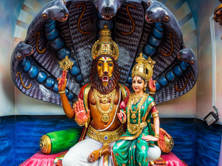 Colourful statues of Hindu religious deities in Hindu temple in Singapore	