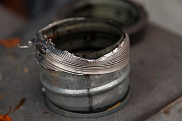 a metal pipe with a large opening, has been used for ventilation in houses