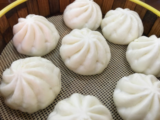Fototapeta premium A steamed bun is placed on a wooden board