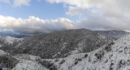 Fototapeta na wymiar Image showing early snowfall on the San Gabriel Mountains in the Angeles national Forest followig a storm on Thanksgiving Day.