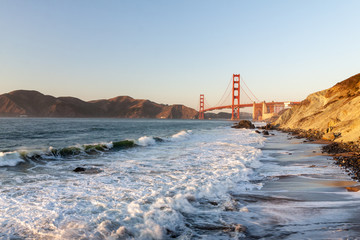 Golden Gate Bridge and Pacific ocean waves view from Marshal's beach in San Francisco California United States
