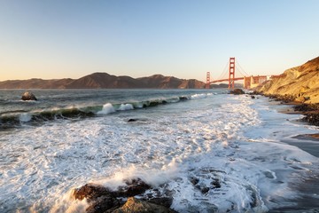 Golden Gate Bridge and Pacific ocean waves view from Marshal's beach in San Francisco California United States