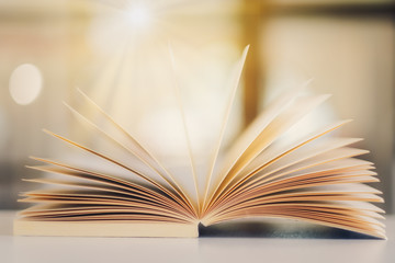Closeup image of an open book on the table