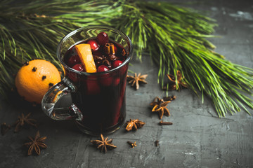 Mulled red wine on the gray rustic background. Selective focus. Shallow depth of field.