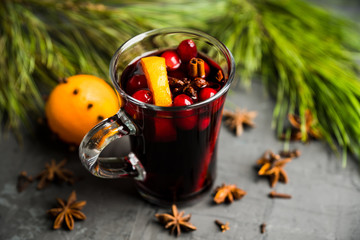 Mulled red wine on the gray rustic background. Selective focus. Shallow depth of field.