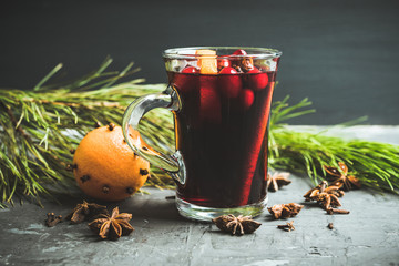 Mulled red wine on the gray rustic background. Selective focus. Shallow depth of field.
